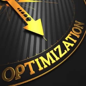Optimization - Business Concept. Golden Compass Needle on a Black Field Pointing to the Word 
