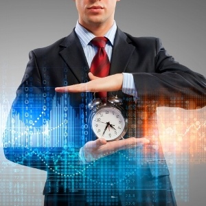 Image of businessman holding alarmclock against illustration background-783494-edited.jpeg