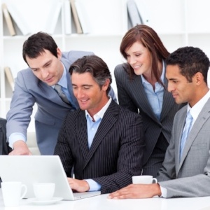 Multi-cultural business team looking at a laptop in the office-999324-edited.jpeg