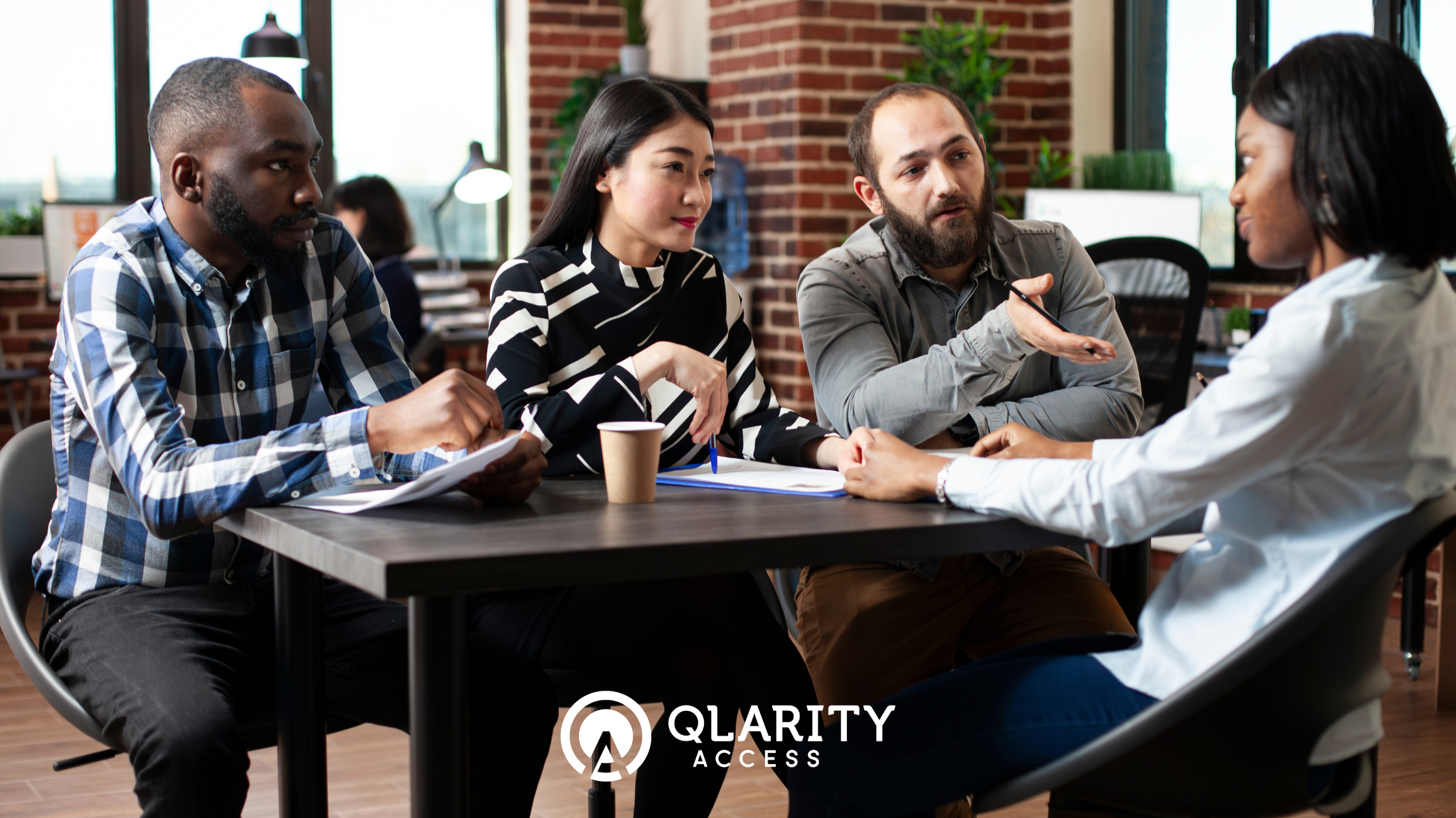 A diverse group of people thoughtfully engaged in a discussion, interview, or focus group.